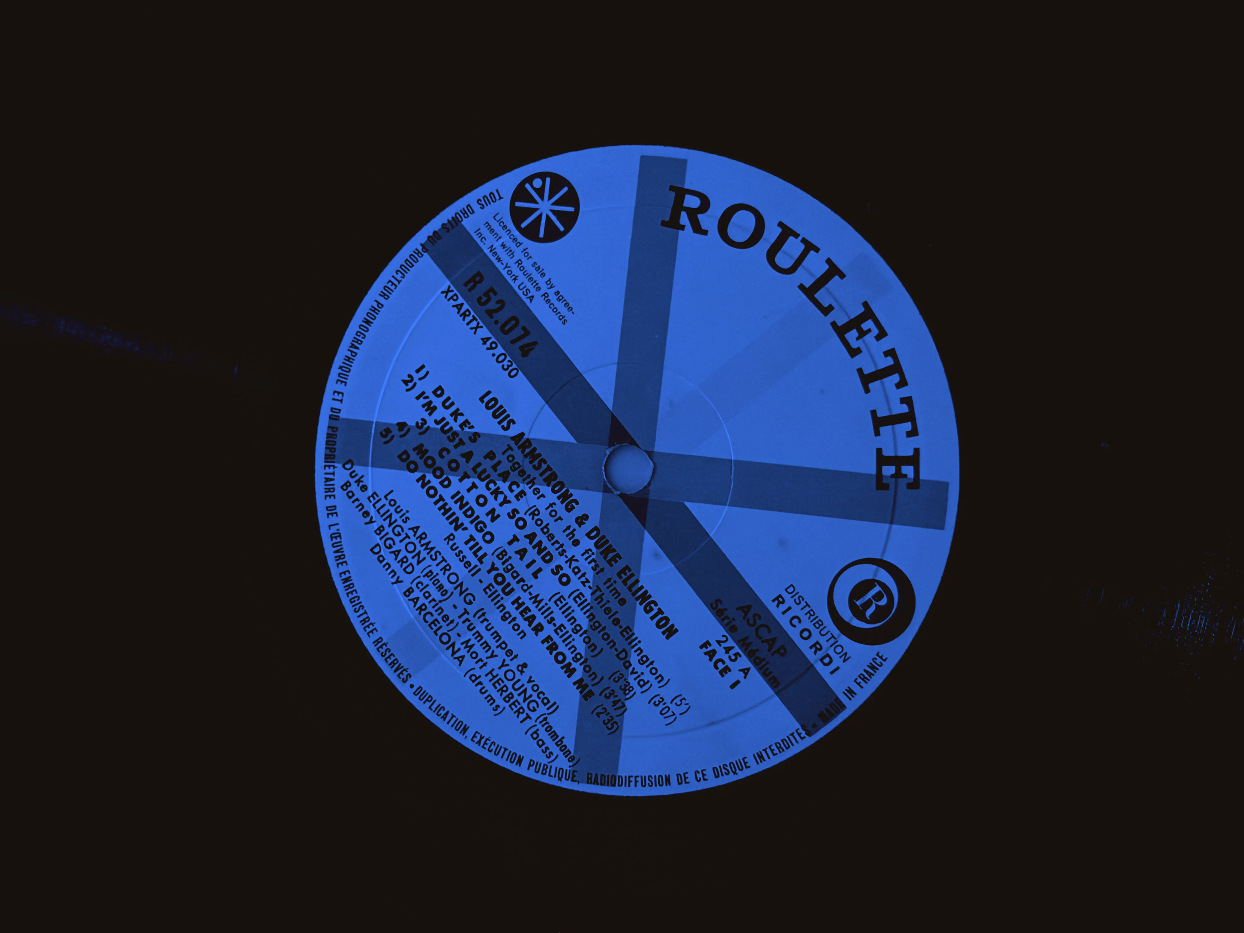 Roulette label on a Louis Armstrong and Duke Ellington record, showing catalogue number R 52.074, printed matrix XPARTX 49.030, and Made in France text